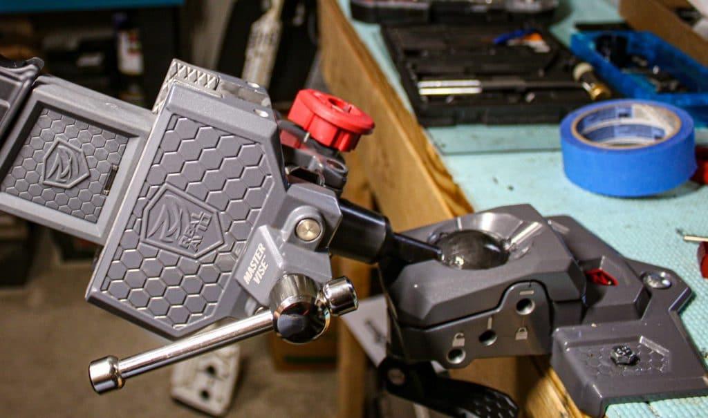 On the bottom of the vise is the ball and socket joint with a speed-cam locking lever that will tighten the ball's position after you tilt it at the angle you want.