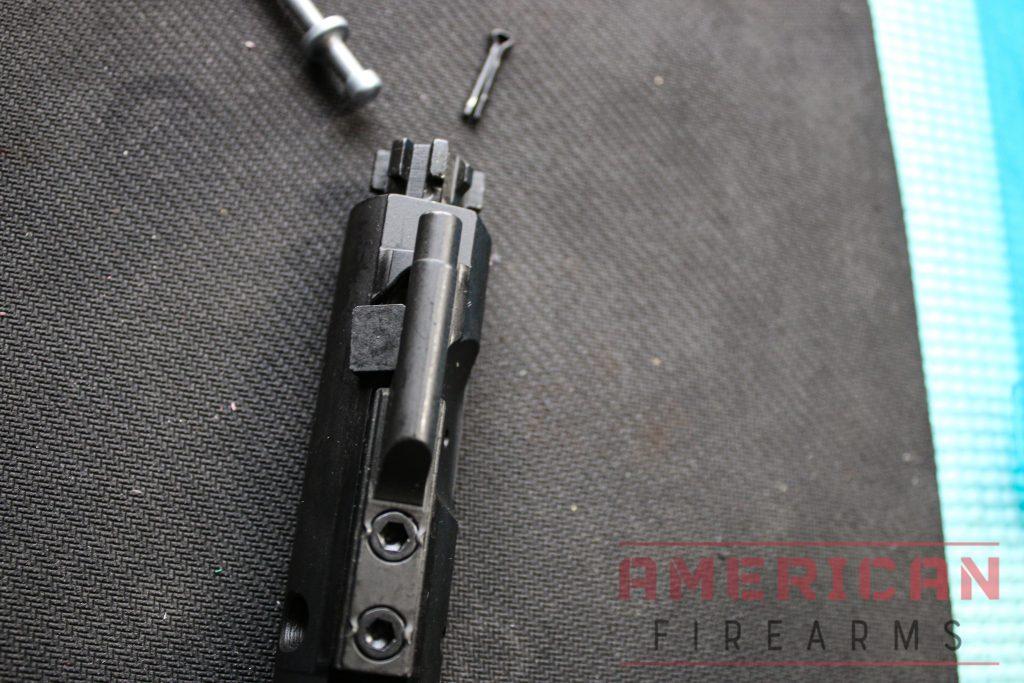 Insert the cam pin into the top of the BCG until it is flush and has gone through the bolt.