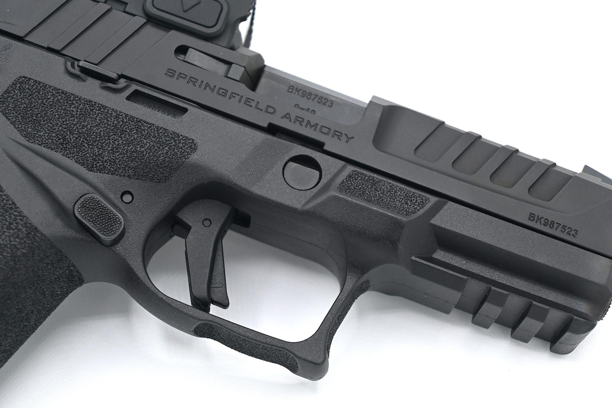 The deep undercut trigger guard allows a high grip that gets the hand close to bore axis — the same technique competitive shooters use, built into the gun's geometry.