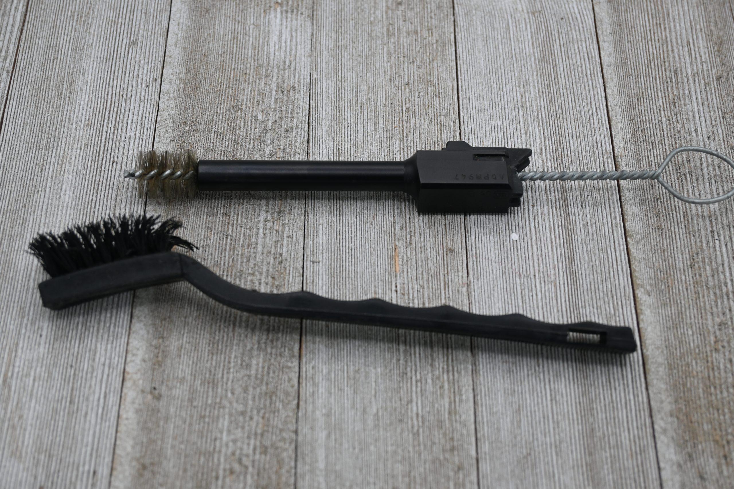 The G44 ships with a set of metal cleaning brushes and a nylon rod—use them.