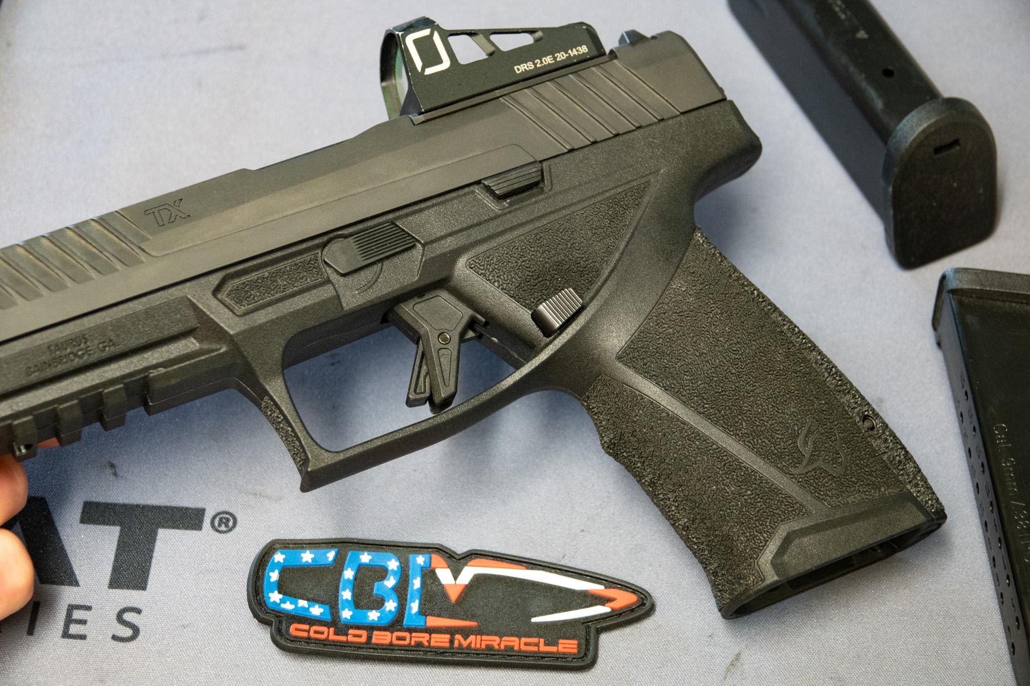 The grip texture isn't just aggressive — it's engineered to prevent slipping under recoil and sweat. The thumb shelves keep your support hand locked in place.