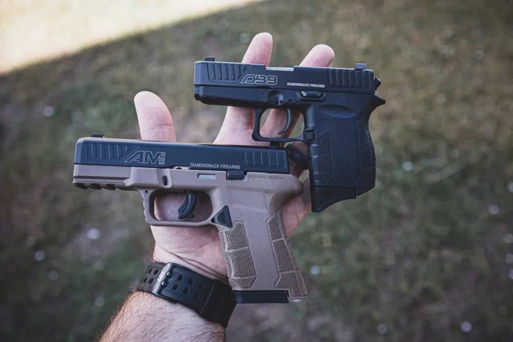 The Diamondback DB9 Gen 4 (top) subcompact is about the size of a man's hand.