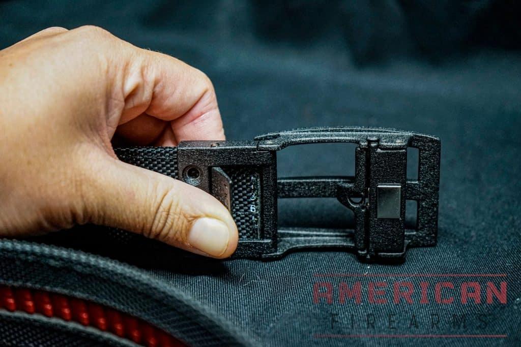 The original Nexbelt release button was on the rear of the buckle. Newer versions now use a bottom-mounted button that's easier to actuate.