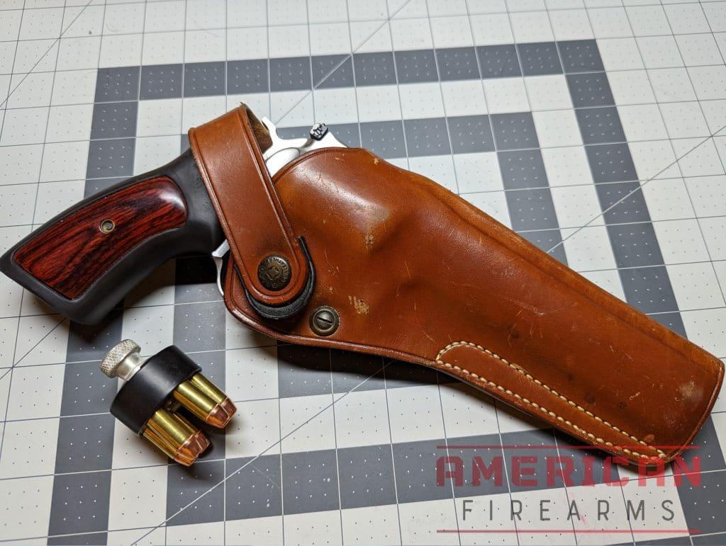A .357 revolver and well-worn leather holster.
