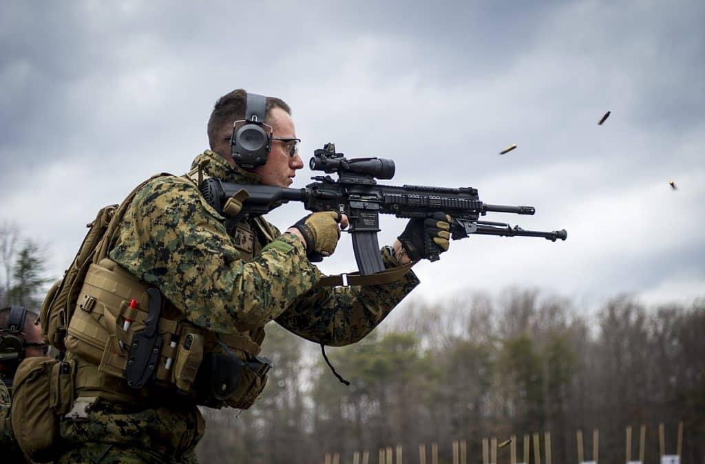 U.S. Marine Sgt. Travis Riggs, with the Marine Security Augmentation Unit (MSAU), engages his target during a weapons field test of the M27 Infantry Automatic Rifle at Marine Corps Base Quantico, Va., Feb. 21, 2014.
