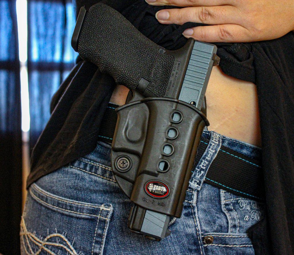 The grip on this Glock is readily available while holstered.