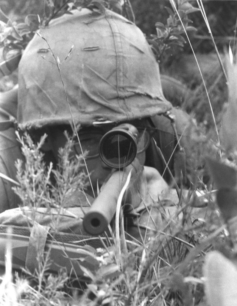 Fig. “Pvt. Randall E. Josey, a Marine sniper attached to Co. H, 2nd Bn., 5th Marines, has a bead on a Viet Cong at over 1,000 meters. Using a 3x9 power scope, a Remington 700 rifle has accuracy up to 1,100 meters and has been used effectively up to 2,000 meters or more.” June 19, 1967 (Photo/caption: U.S. Marine Corps History Division)