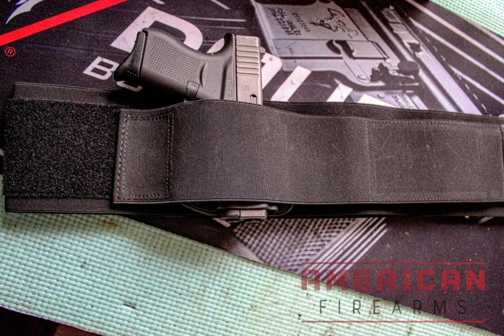The Modular Belly Band's strap secures over the fiream and Kydex holster for a tight  fit.