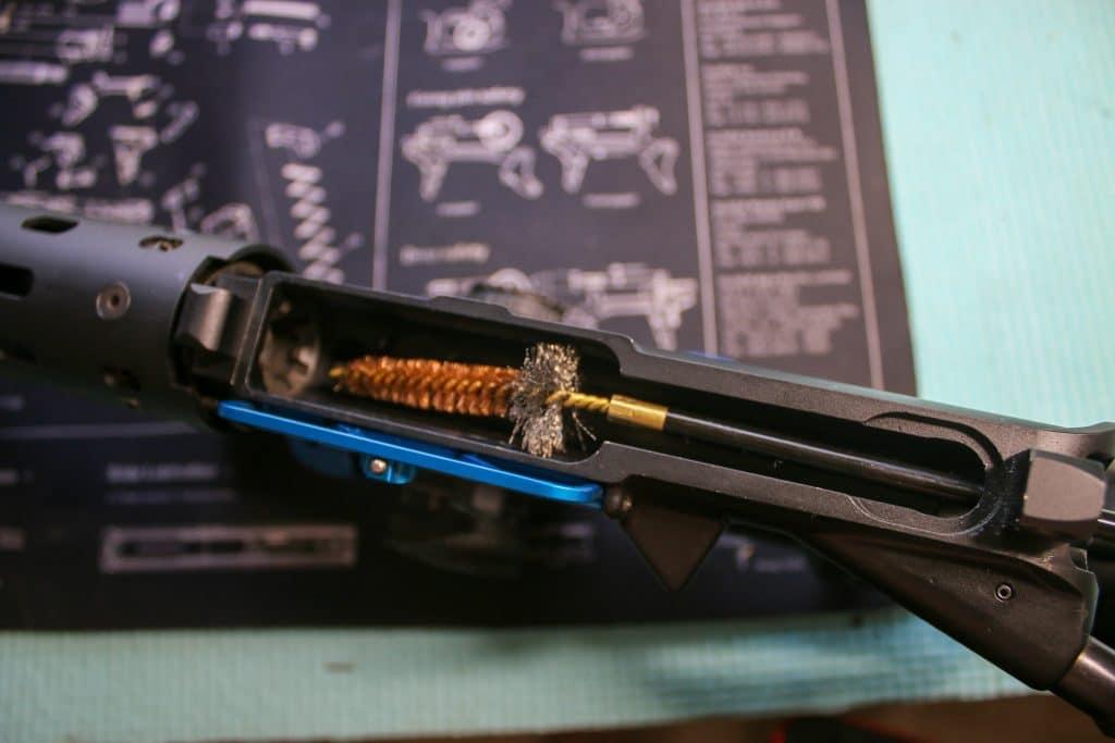A rifle cleaning kit should include a chamber brush, which pairs bronze bristles with a wider base.