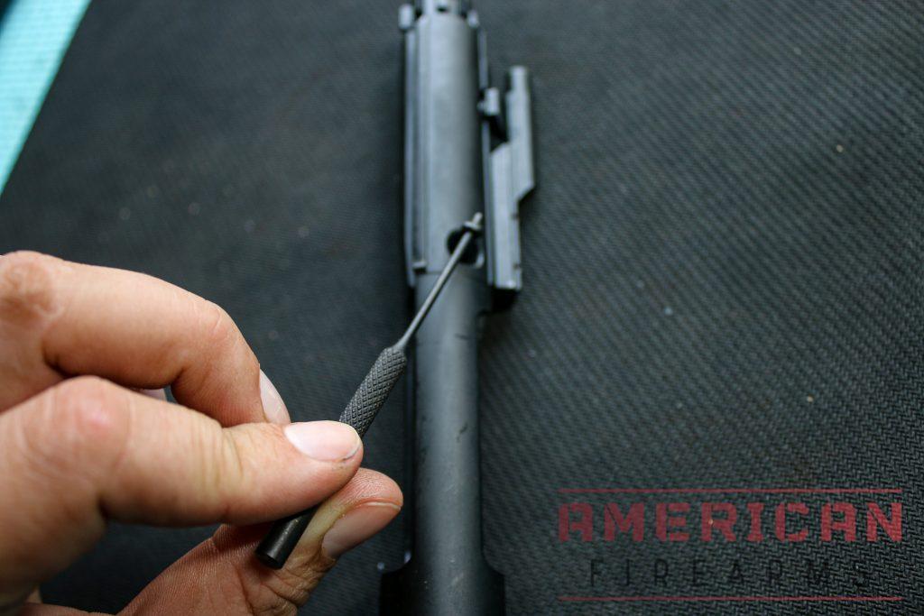 Once the firing pin is in, insert the firing pin retaining pin from the larger opening on the side of the BCG.