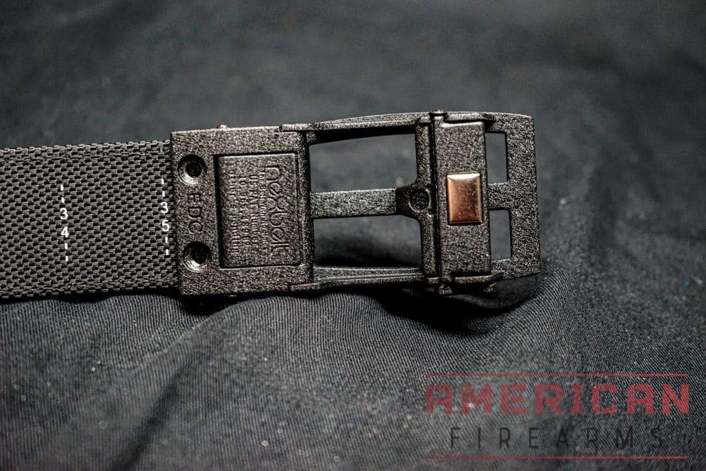 The Titan BD buckle uses dual screw retention and a rearward release button. Newer models use a three screw design and a bottom-mounted release that makes actuation mush more straightforward.