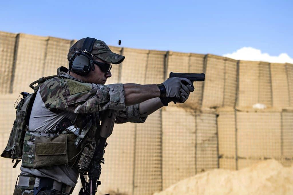 A U.S. Air Force pararescueman, assigned to the 83rd Expeditionary Rescue Squadron, Bagram Airfield, Afghanistan, fires his Glock 9mm handgun during weapons training Feb. 21, 2018.  The pararescuemen train with their secondary weapon to ensure they remain capable of firing in the event their primary weapon becomes ineffective or runs out of ammo. (U.S. Air Force Photo by Tech. Sgt. Gregory Brook)