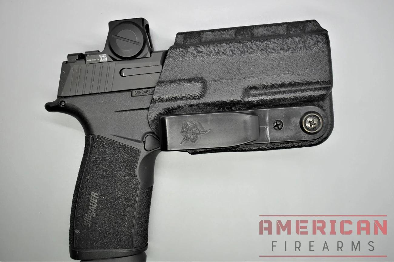 A well-fitted Kydex or leather shell grips the trigger guard and frame tightly enough that friction alone holds the gun in place.