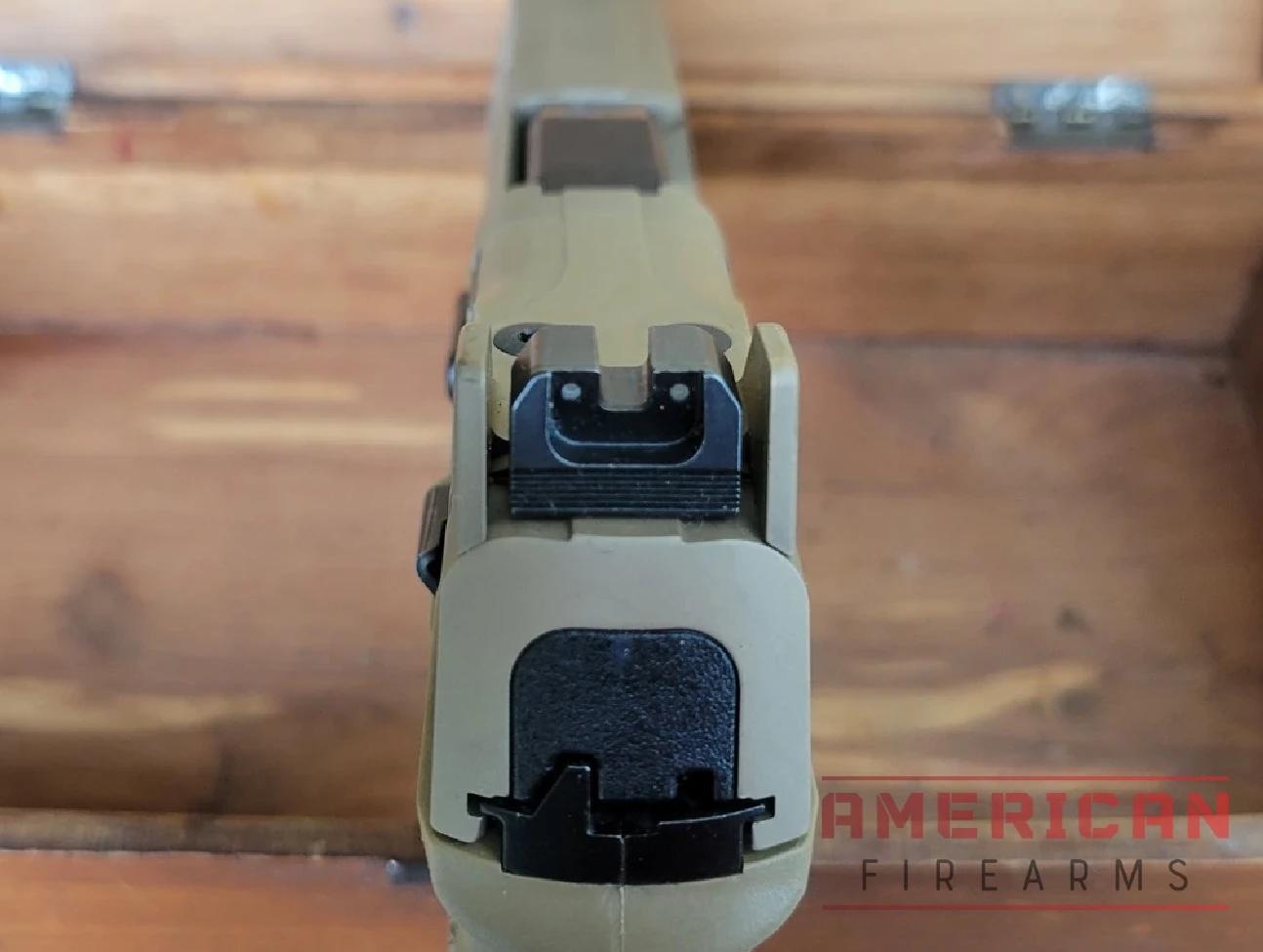 The slide's removable "ears" protect the rear sight.