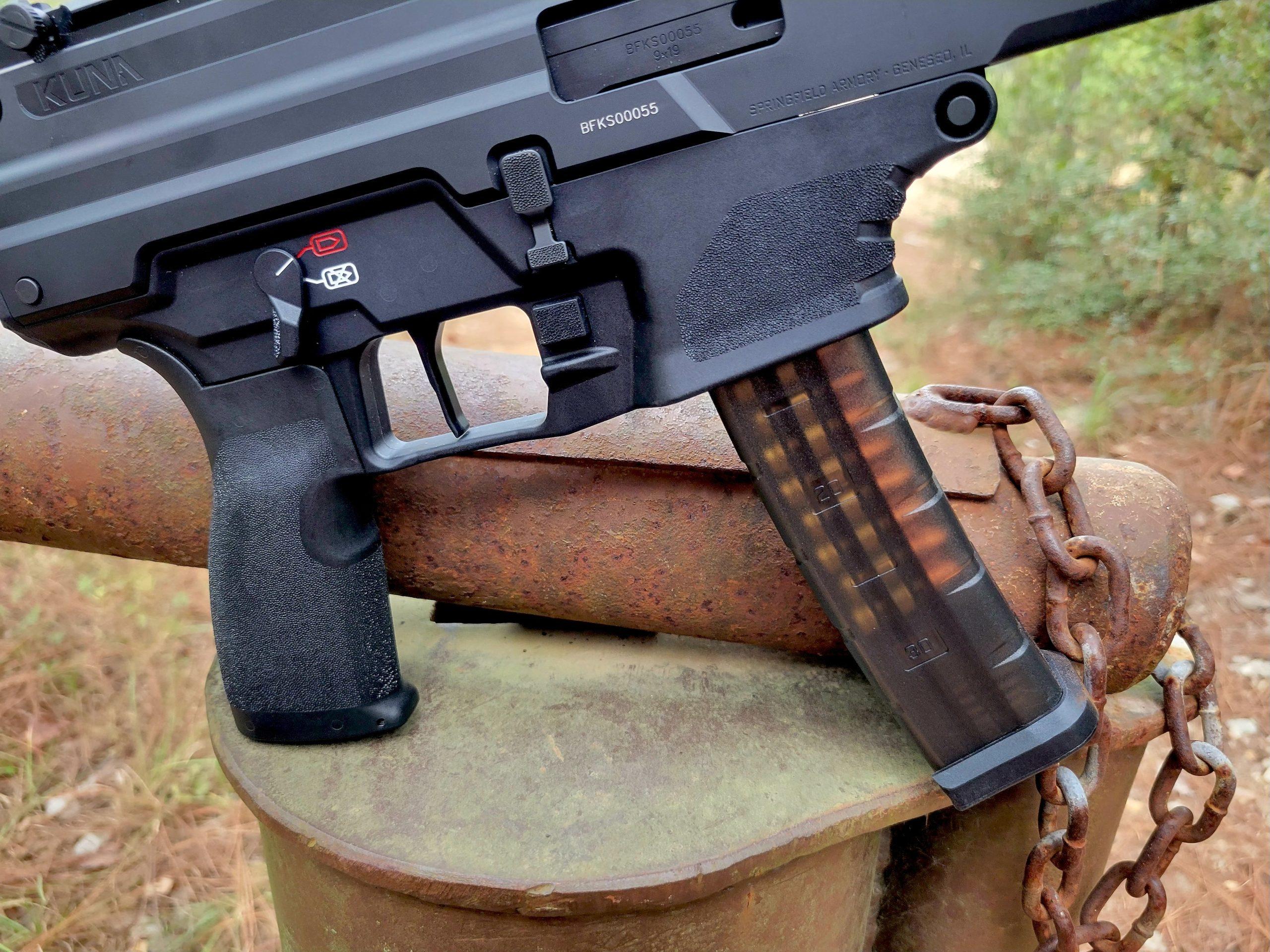 The Kuna's proprietary sticks are translucent smoke-colored polymer with steel feed lips, similar in concept to SIG MPX magazines.