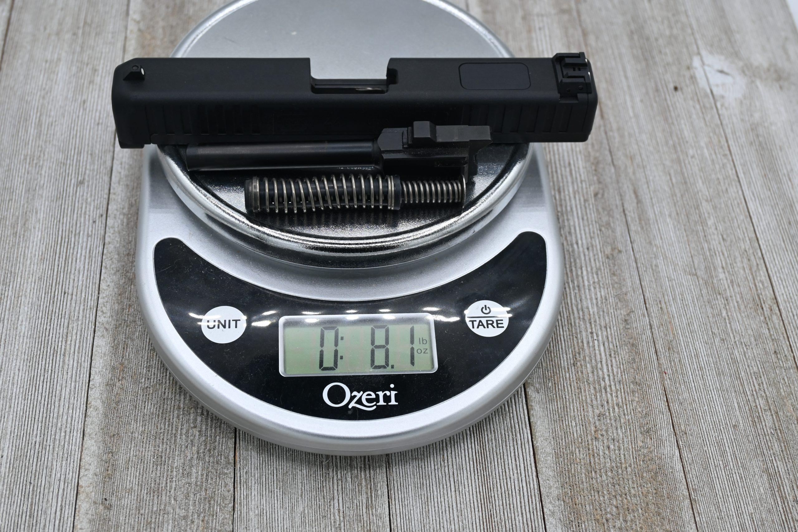 The whole package of slide, barrel, and recoil spring weighs in at just over 8 ounces.